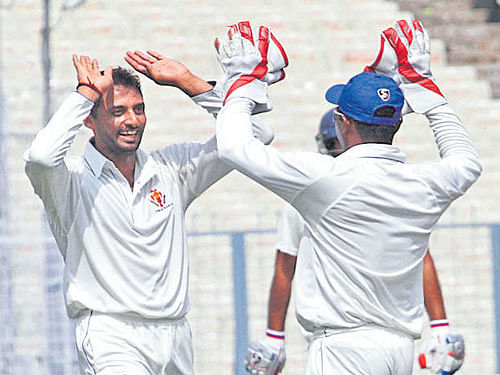 on song S Arvind (left) celebrates with C M&#8200;Gautam after taking a Delhi wicket on Thursday.