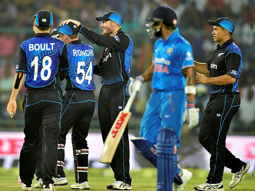 New Zealand cricketers celebrate the wicket of Indian batsman Virat Kohli during 2nd ODI match in New Delhi on Thursday. PTI Photo