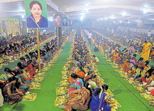 AIADMK women members offer prayers by lighting 1,508 lamps at a temple for the speedy recovery of their leader and Tamil Nadu Chief Minister J Jayalalithaa who is hospitalised, in Coimbatore on Friday. PTI