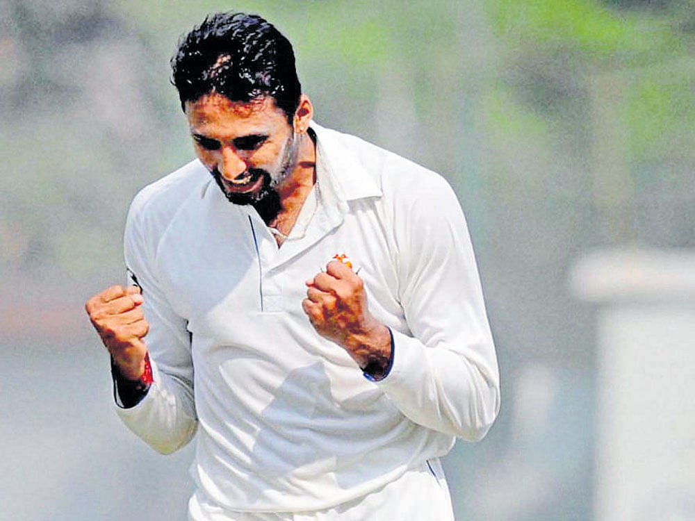 Karnataka speedster Sreenath Arvind celebrates an Assam wicket during their Ranji Trophy fixture. PTI