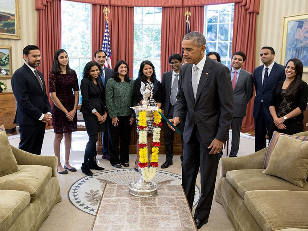 Obama celebrates Diwali, lights first-ever diya in Oval Office. Courtesy: President Obama