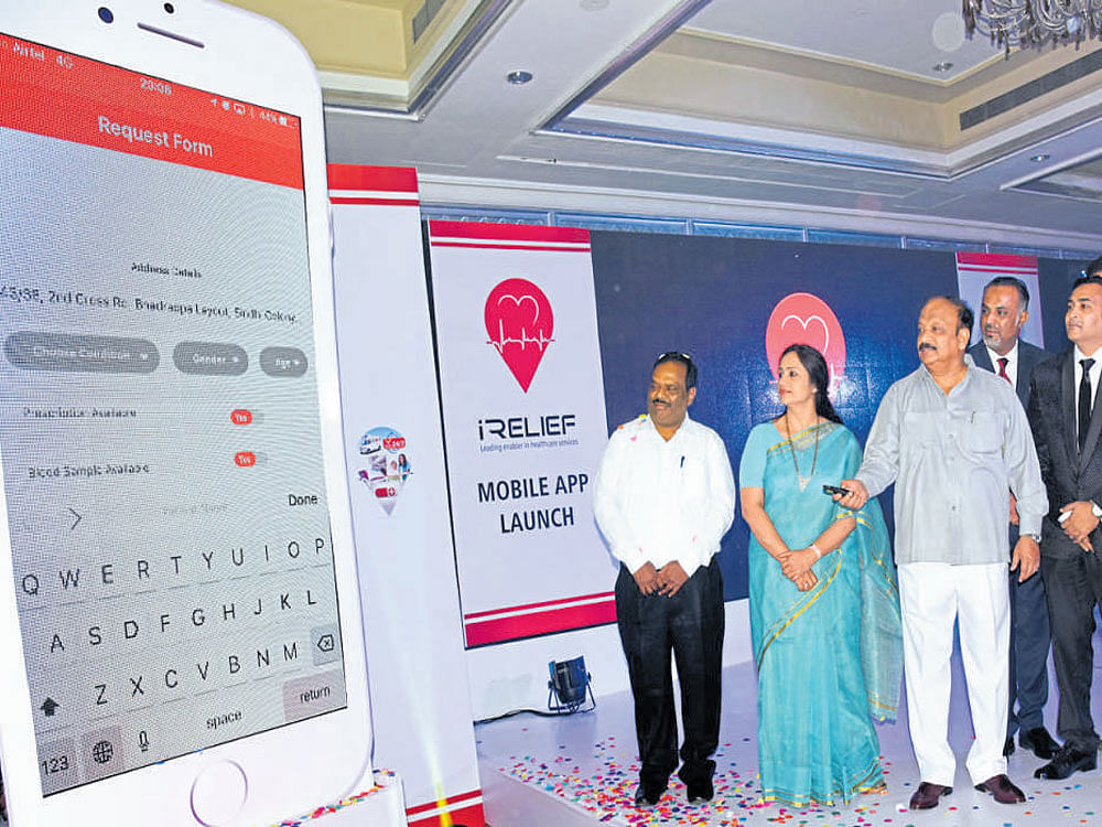 Minister R Roshan Baig inaugurates the mobile application for location-based blood, ambulance and home care services in Bengaluru on Thursday. dh photo