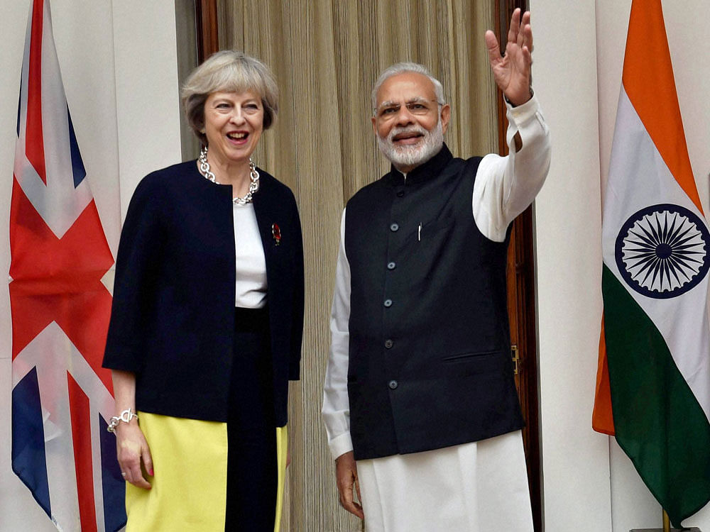 British Prime Minister Theresa May with PM Modi. PTI