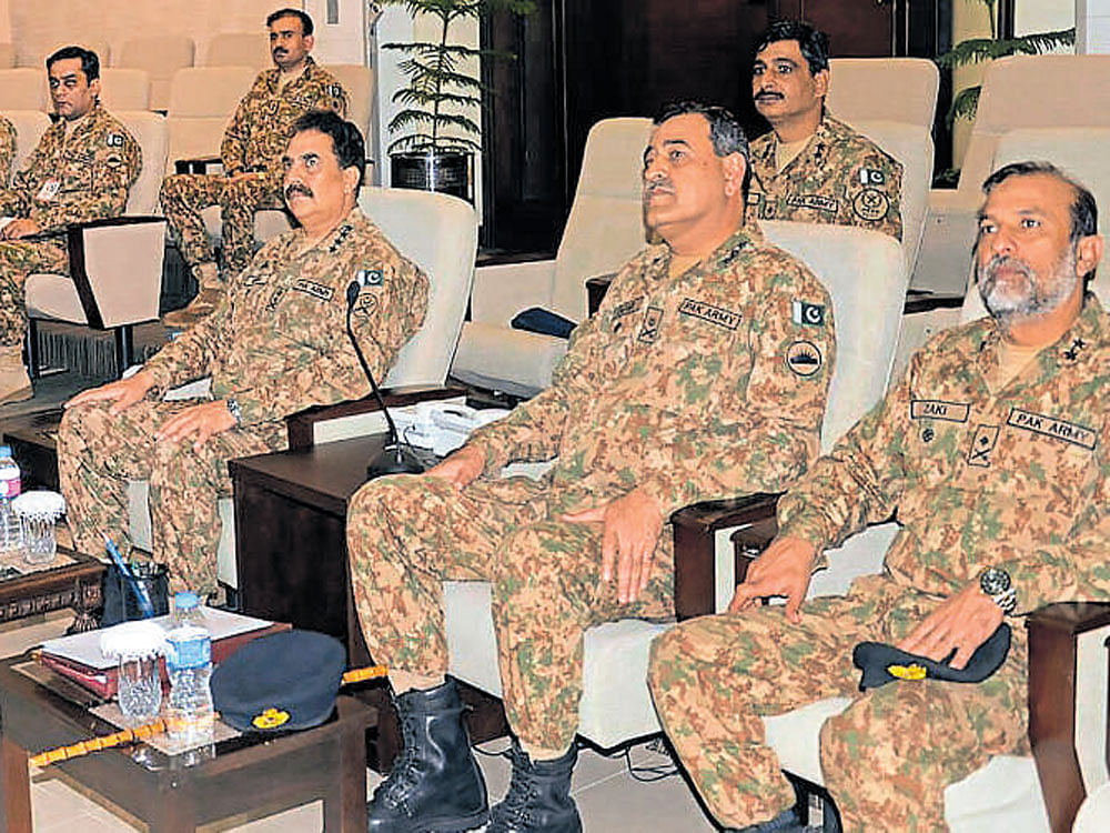 Pakistani army chief Raheel Sharif (C) and military officials during a security briefing on Monday. AFP