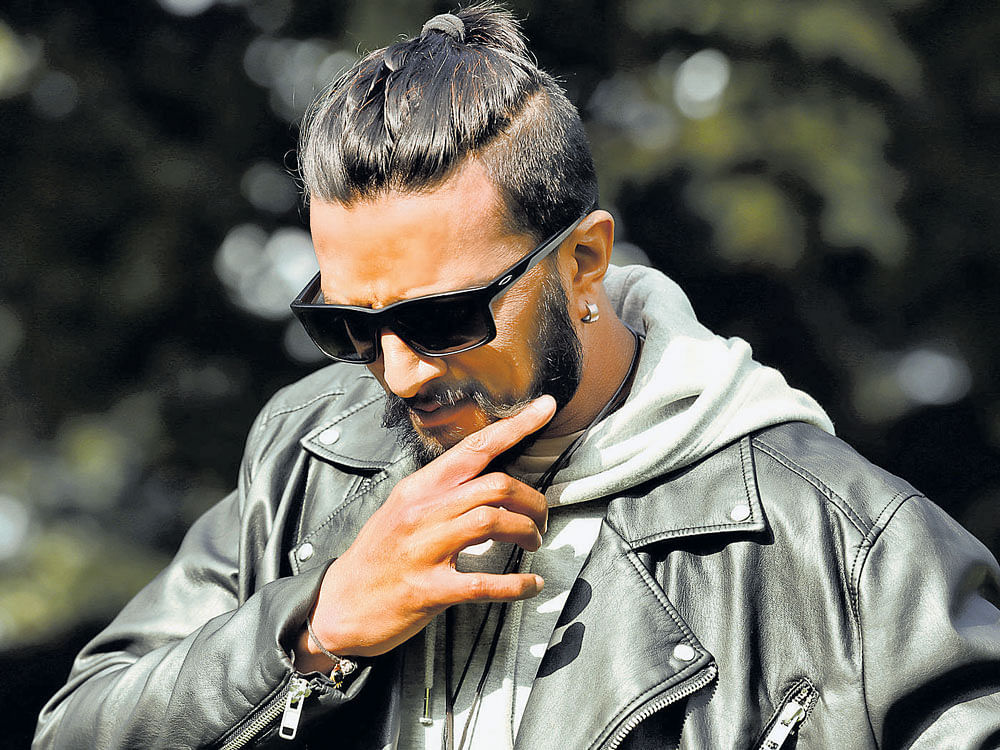in a new avatar Sudeep's look in  'Hebbuli', an upcoming action thriller.