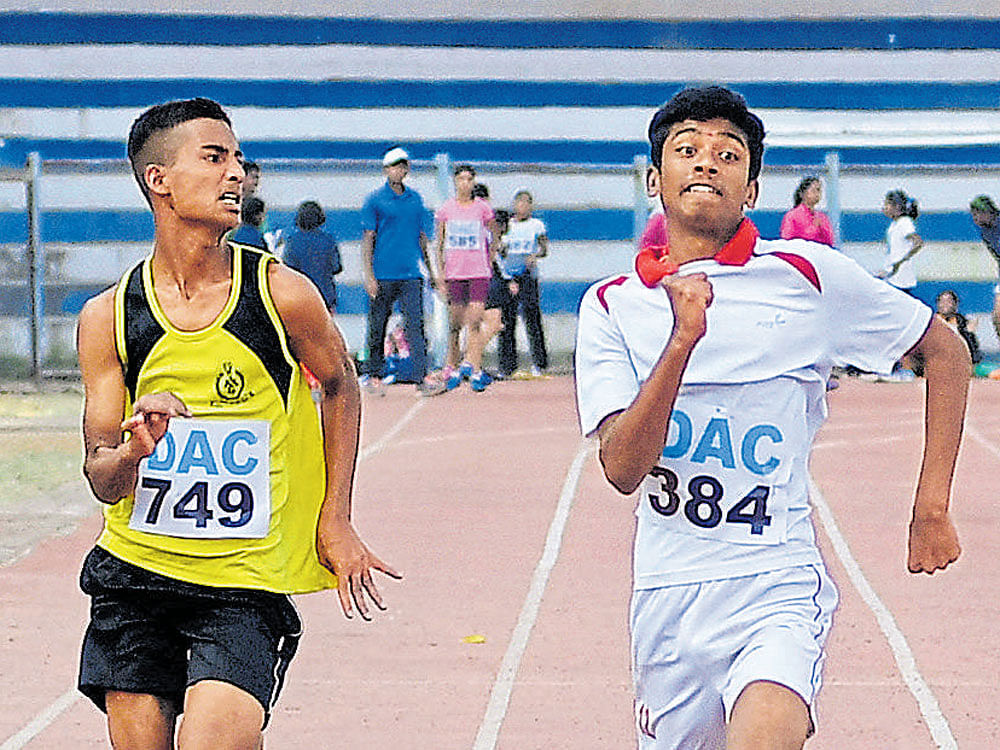 Powering through: LEFT: Dhanush (No 384) of Evershine English School powers to victory in the boys' U-13 100M at the DAC Meet on  Sunday. DH Photo.