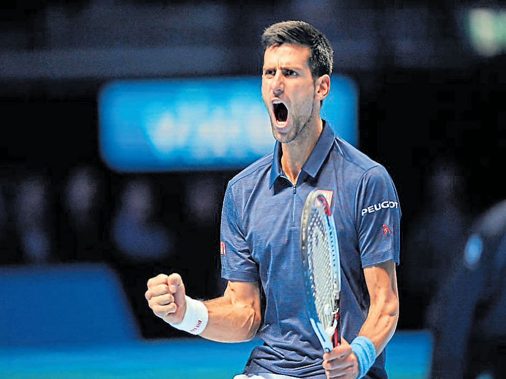 ecstatic Serbia's Novak Djokovic celebrates his win over  Kei Nishikori at the O2 Arena in London. Reuters
