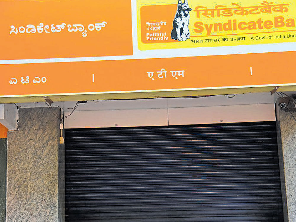 An ATM kiosk remains shut in Malleswaram on Sunday. dh photo