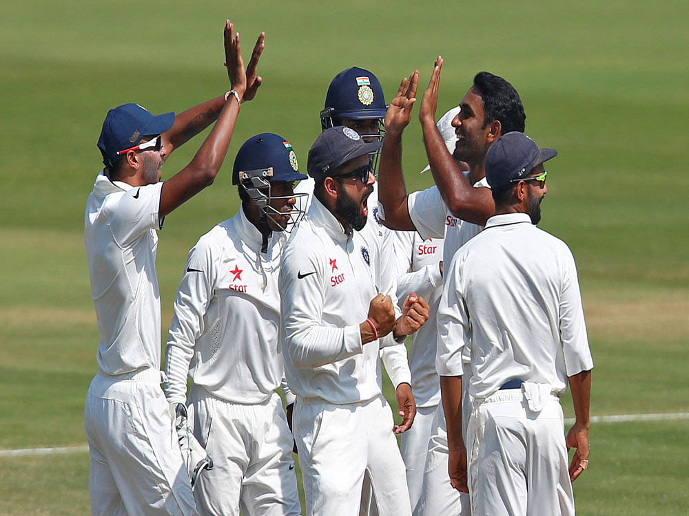 Indian players celebrate the dismissal of England's Ben Stokes. Reuters Photo