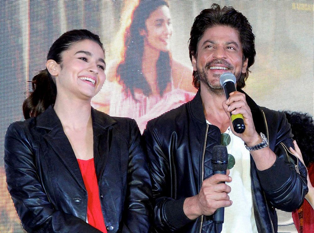 Bollywood actors Shah Rukh Khan and Alia Bhatt at a promotional event of their upcoming film Dear Zindagi in Gurugram on Tuesday. PTI Photo