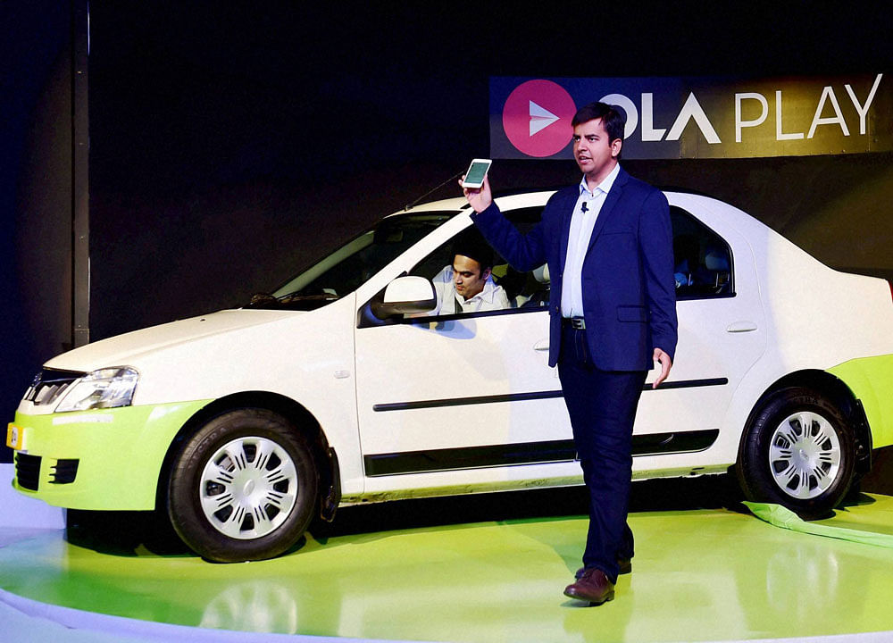 Bhavish Aggarwal, CEO & Co-founder, OLA at the launch of the 'Ola Play', a mobile app to connect car platform for ride sharing, during a press conference in Bengaluru on Tuesday. PTI Photo