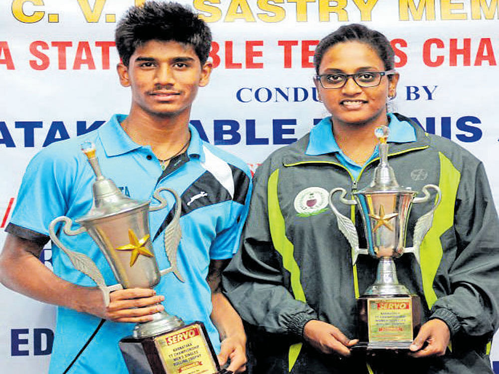 champions: Rakshit B and Swetha K, winners of men's and women's singles titles on Thursday. dh photo
