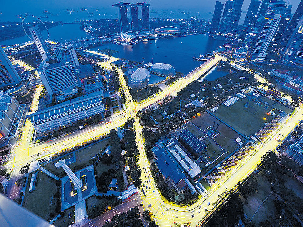 BRIGHT LIGHTS The Singapore Grand Prix takes place at night on a street circuit, making it hugely popular. AFP