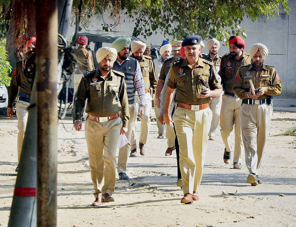 Police officials investigate after five inmates of Nabha Jail, including Khalistan Liberation Force chief Harminder Mintoo, escaped near Patiala on Sunday. PTI
