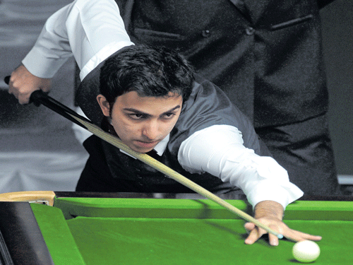 Advani defeated Thailand's Thanawat Tirapongpaiboon 6-5 in an exciting quarterfinal duel to guarantee India a medal in the men's tournament. DH file photo