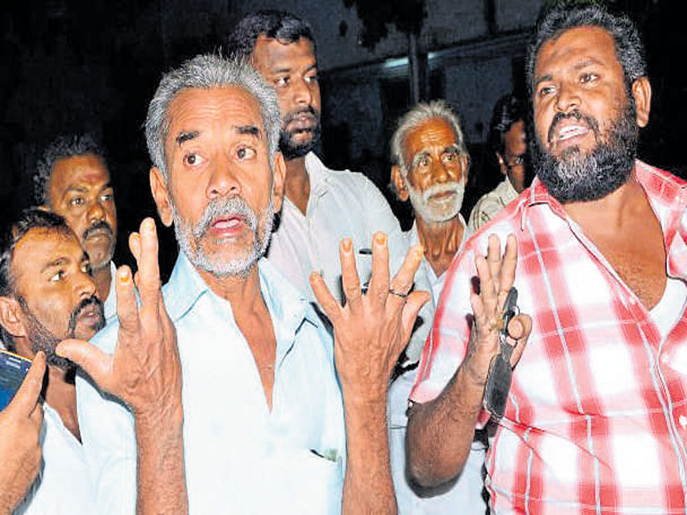 Family members of the three suspected al Qaeda men in front of the Madurai court on Monday. PTI