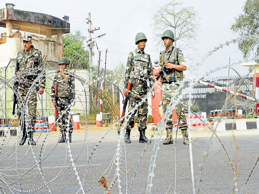 Army personnel stand guard at 16 Corps headquarters during the search  operations following an attack on the Nagrota Army camp, in Jammu on Wednesday. PTI