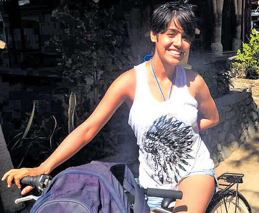 ALL SMILES The author cycling in Gili Trawangan Island.