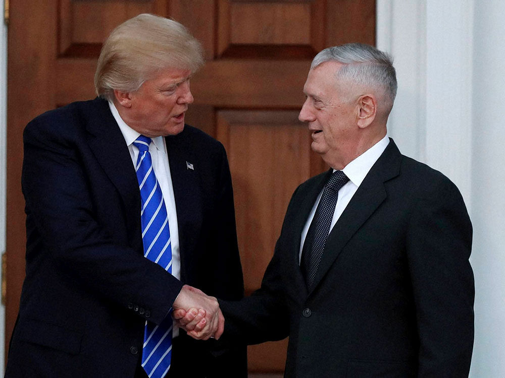 President-elect Donald Trump shakes hands with retired Marine Corps Gen. James Mattis as he leaves Trump National Golf Club Bedminster clubhouse in Bedminster, N.J. Trump said at a rally on Dec. 1, that he will nominate Mattis as defense secretary. AP/PTI Photo