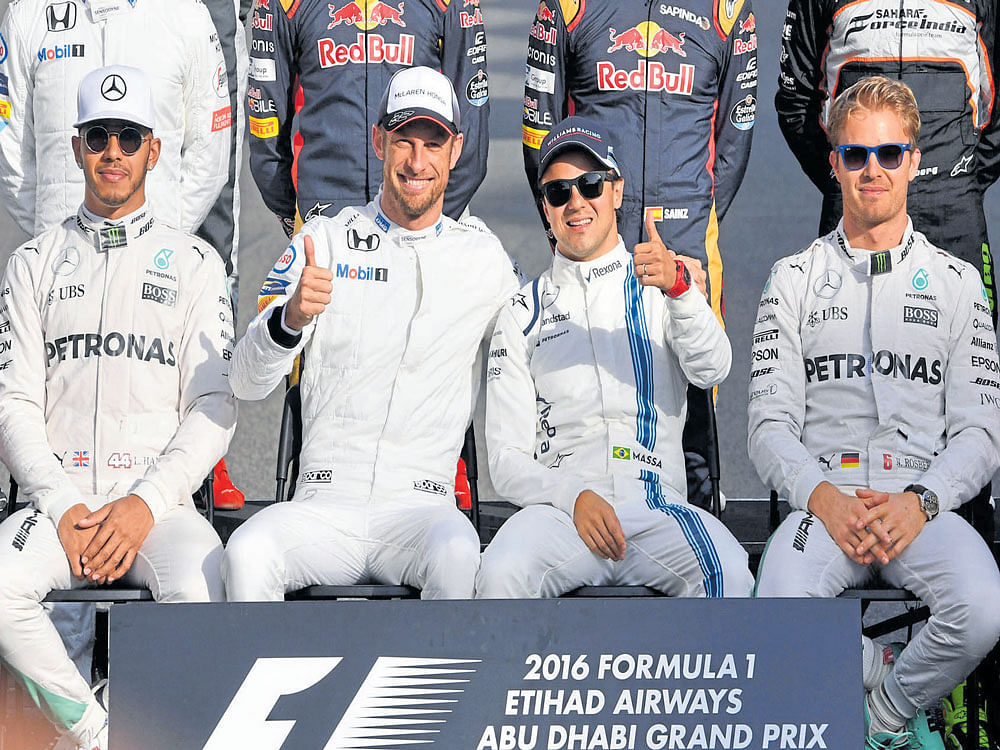 superstars Jenson Button (centre, left) and Felipe Massa are flanked by Lewis Hamilton (left) and Nico Rosberg at the Abu Dhabi Grand Prix. Rosberg edged Hamilton to win the title while Button and Massa moved away from the spotlight. AFP