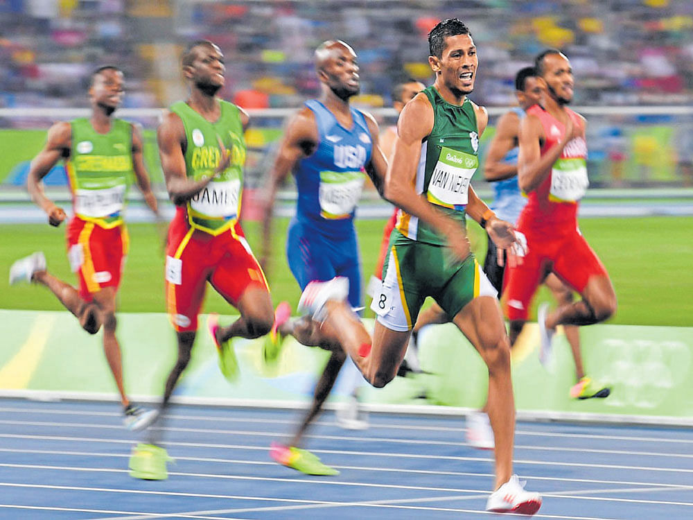 record-breaker: Wayde van Niekerk (right) stunned the world with his burst from lane eight in the 400M final at the Olympic Games in Rio. AFP