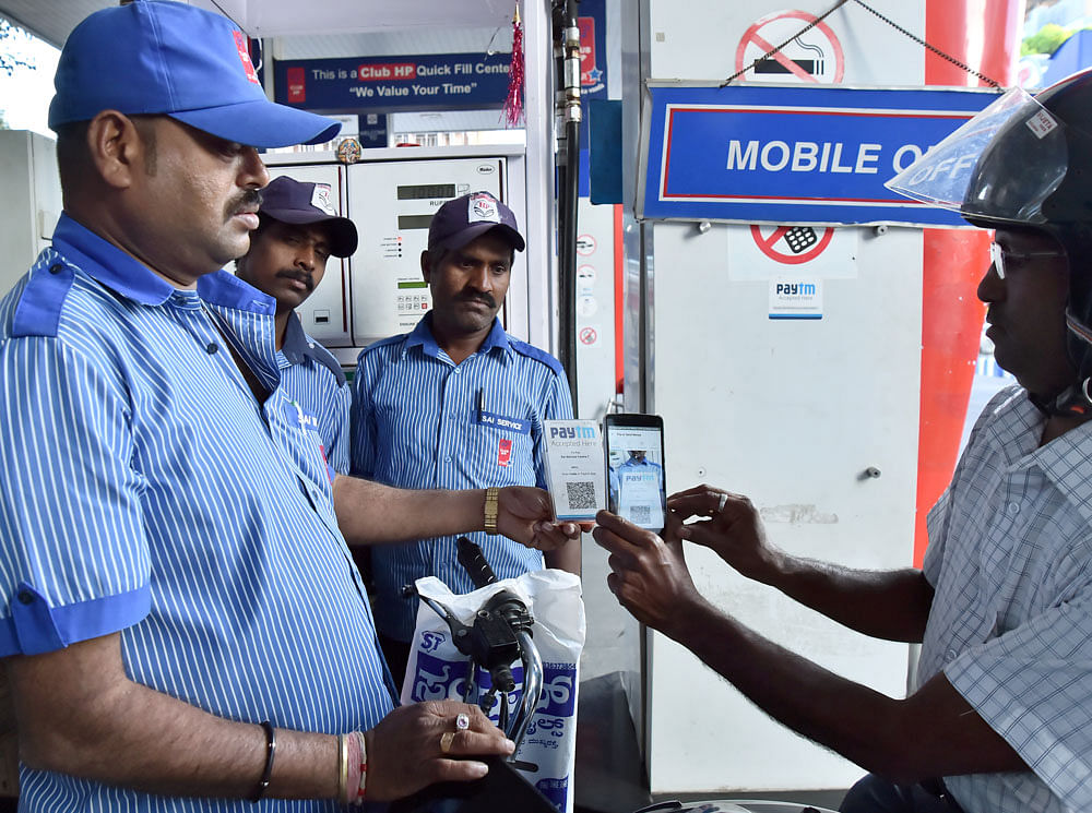 The minister said the government will launch a month-long awareness drive at all petrol pumps in the first phase to promote digital payment services. Petrol pumps will instal kiosks to help people not just buy fuel, but also tell them to use online payment solutions. DH file photo