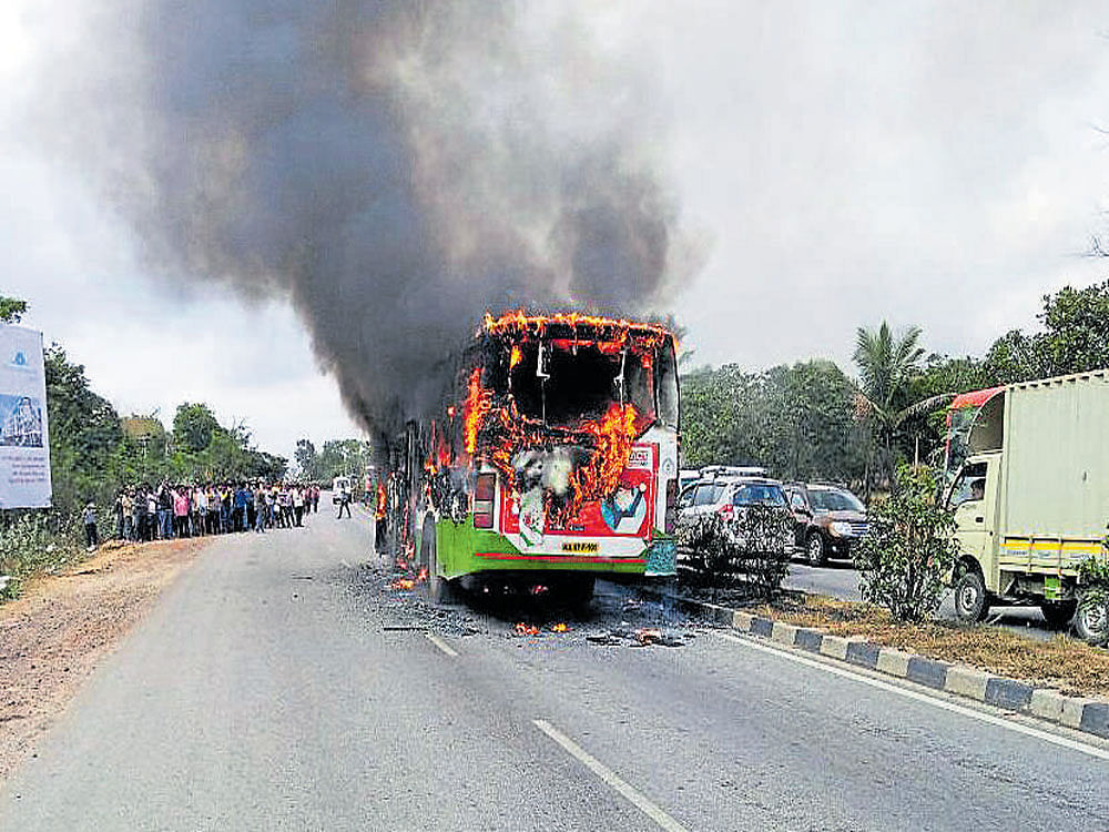 The BMTC bus carrying schoolchildren which caught fire near Mudigere at Channapatana, Ramanagaram district, on Saturday. There were no casualties.