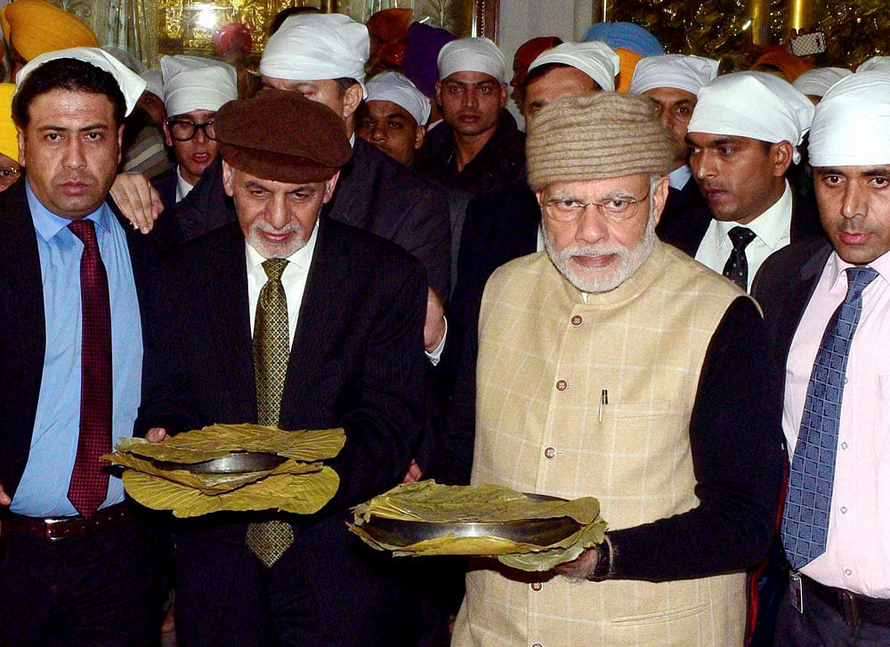 Prime Minister Narendra Modi and Afghanistan's President Ashraf Ghani at Golden temple on the eve of the Heart of Asia Conference, in Amritsar on Saturday. PTI Photo