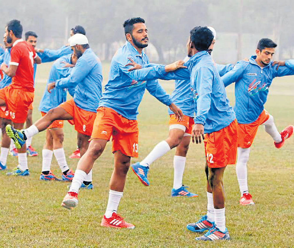 Gearing up Indian players during a training session ahead of their game against Canada in Lucknow on Wednesday.