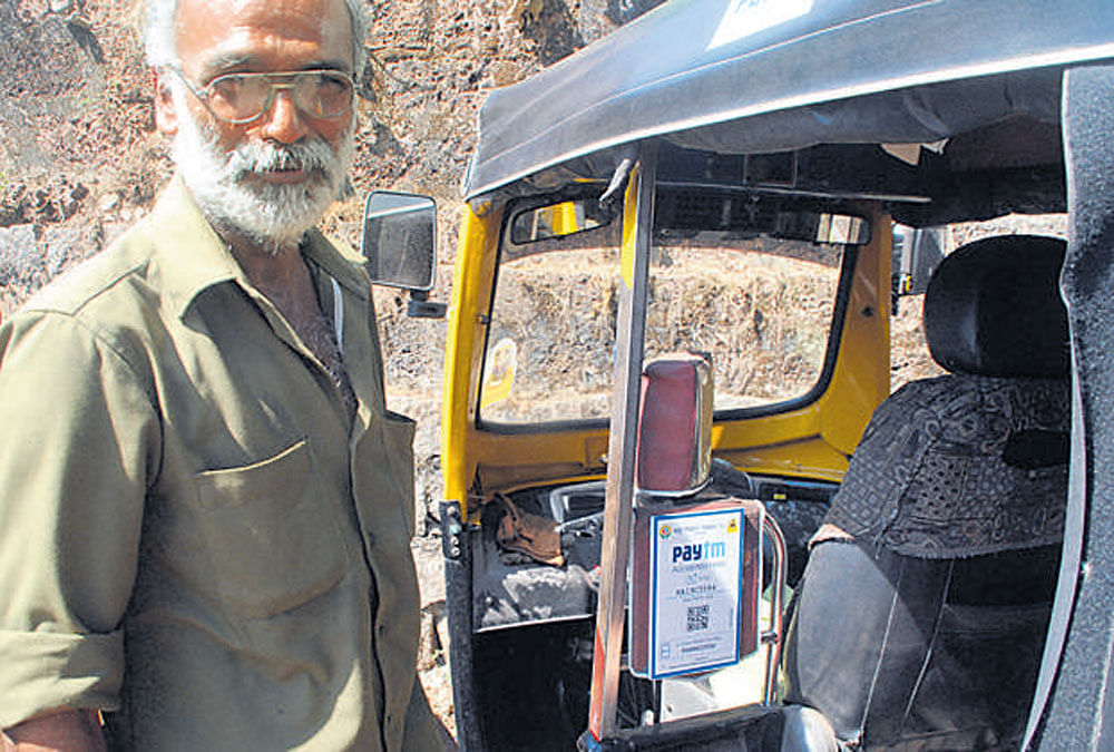 Ashok, one of the seven drivers who have installed Paytm  in their autorickshaws in Mangaluru.