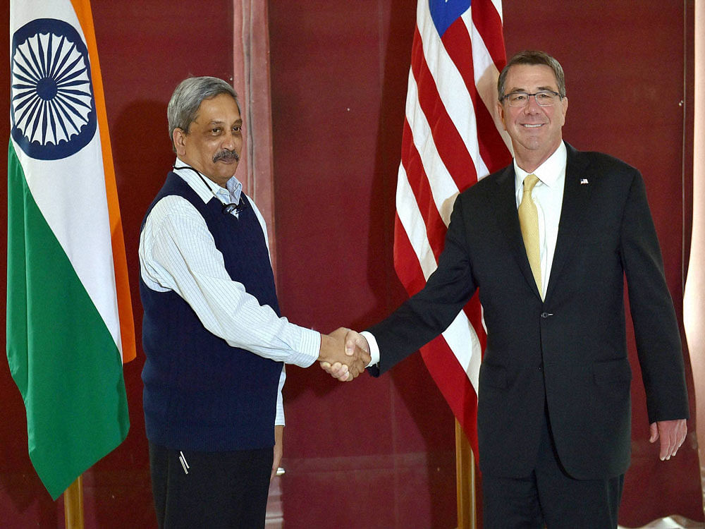 Defence Minister Manohar Parrikar shakes hand with US Secretary of Defense Ashton B. Carter before their meeting at South Block in New Delhi on Thursday. PTI Photo