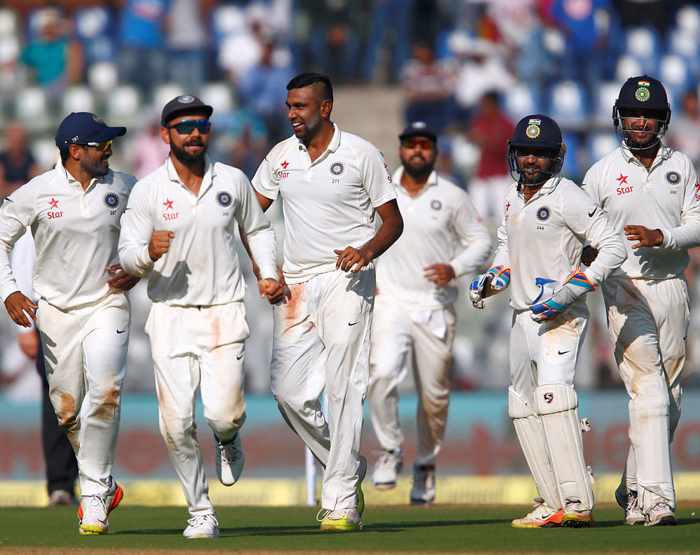 India's players celebrate the wicket of England's Jonny Bairstow. REUTERS