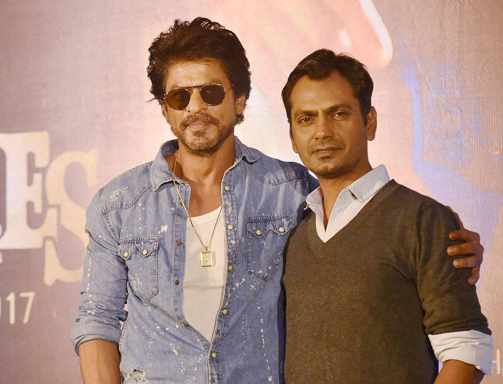 Bollywood actor Shah Rukh Khan actor Nawazuddin Siddiqui during a press conference for the upcoming movie 'Raees' in Mumbai. PTI file Photo