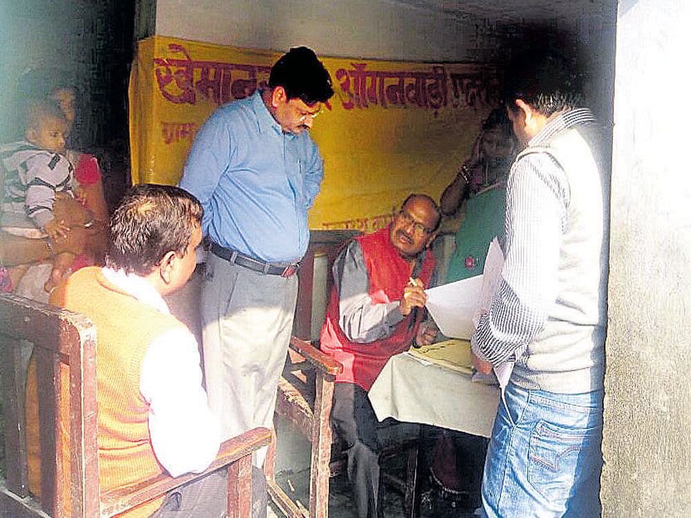 Dr Ashok Kumar with patients at a camp in Allahabad.