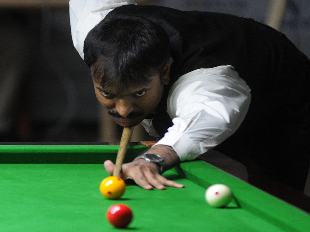 Eyes on the target: Indian veteran B Bhaskar in action during his World Billiards Championship game against Myanmar's Aung Htay at the KSBA hall. DH PHOTO/ Srikanta sharma r