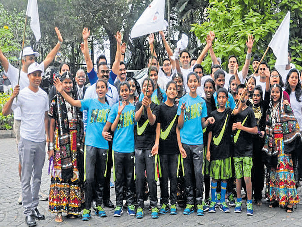 enthusiastic The organisers of 'Run for Saksham' with the children.