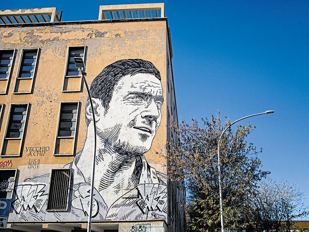 A mural of AS Roma's Francesco Totti on the wall of his childhood school in Rome's San Giovanni neighbourhood. New York Times