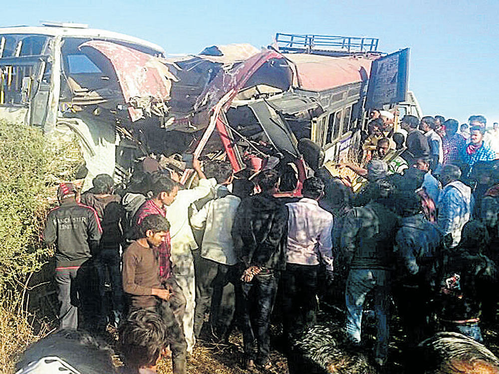 The mangled remains of NEKRTC and Maharashtra State Road Transport Corporation buses, which collided head-on near Umarga of Osmanabad district, Maharashtra.