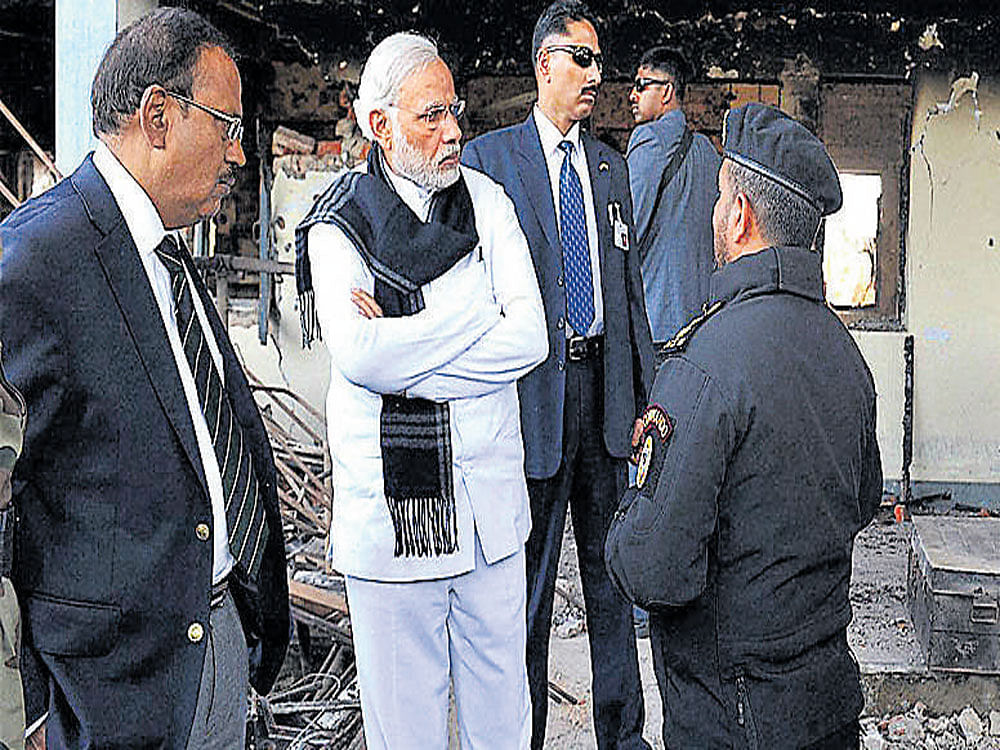 Prime Minister Narendra Modi and National Security Advisor Ajit Doval at the Pathankot airbase. PTI file photo