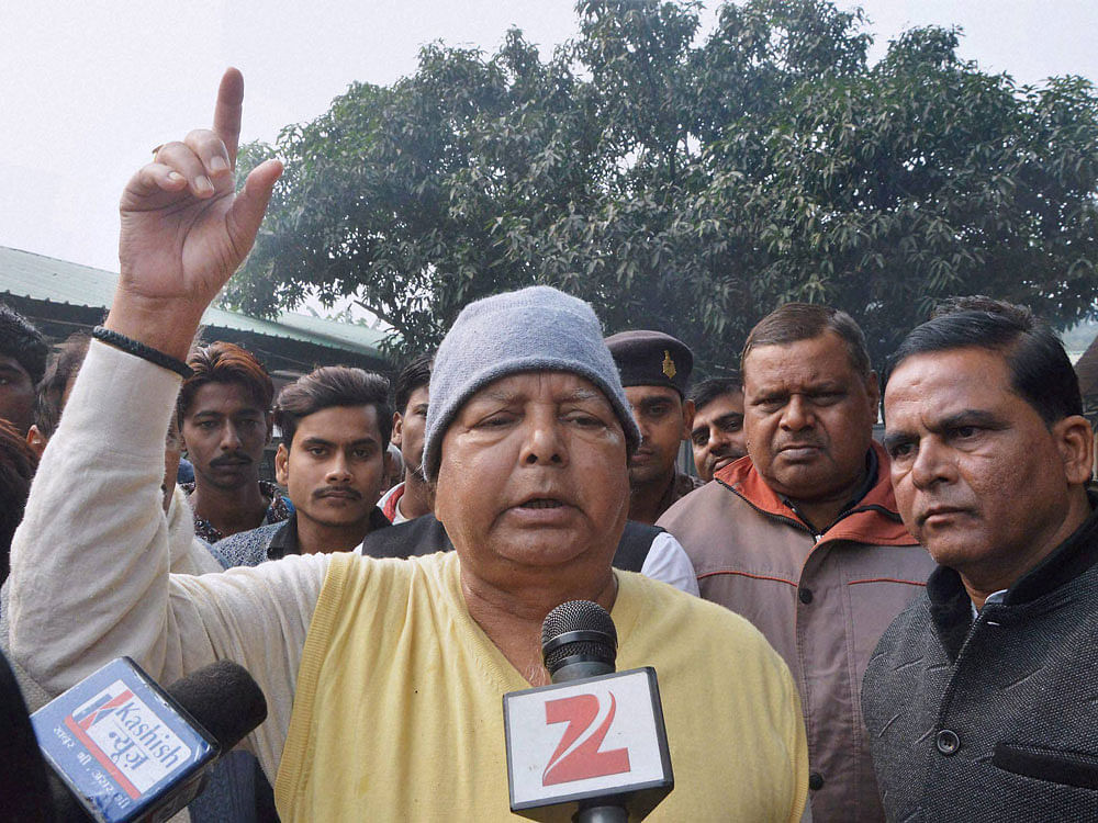 RJD Chief Lalu Prasad talks to the media about demonetization at his residence in Patna on Monday. PTI Photo