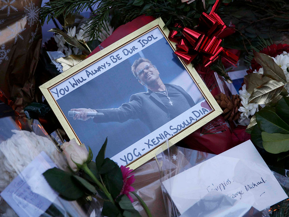 Tributes are seen outside the house of singer George Michael, in north London, Britain December 26, 2016. REUTERS Photo