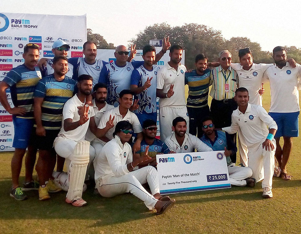 Jharkhand Cricket Ranji team celebrates after win quarter-final match against Haryana,at the Moti Bagh Stadium in Vadodara on Monday. PTI Photo