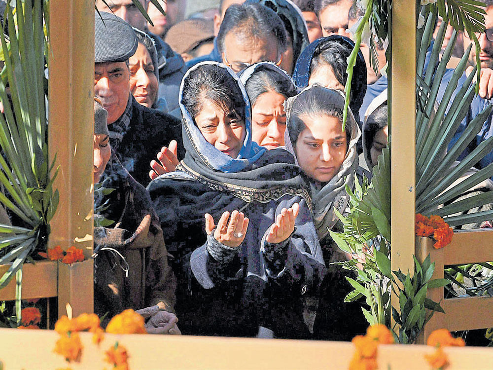 Jammu and Kashmir Chief Minister Mehbooba Mufti along with her family at the grave of her father and former chief minister Mufti Mohammad Sayeed. PTI file photo