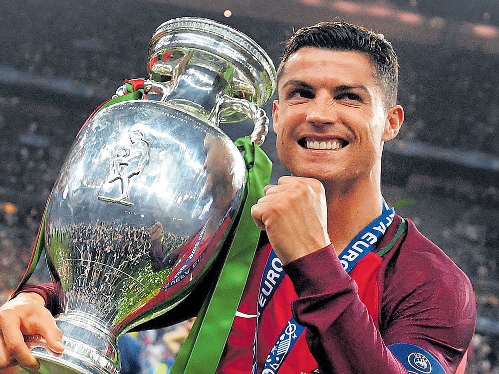 reasons to smile Crisitiano Ronaldo, who had a wonderful year, led Portugal to their first major title. afp