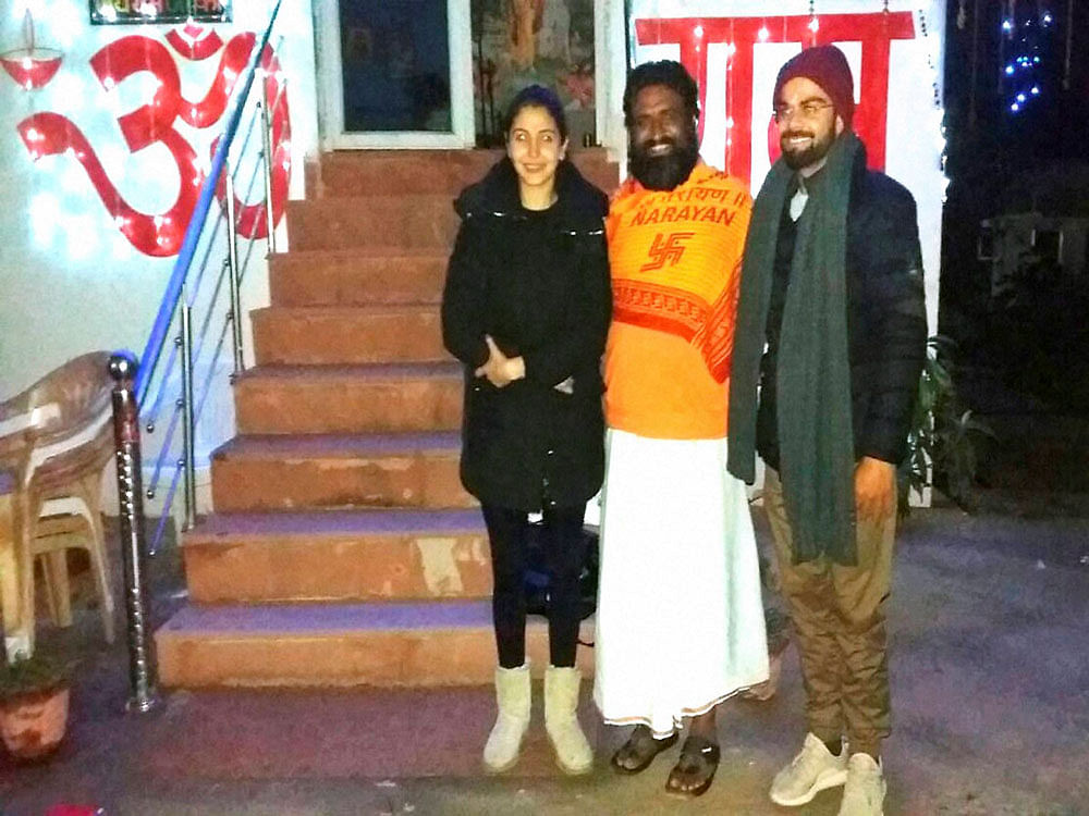 Cricketer Virat Kohli and actor Anushka Sharma at an ashram in Haridwar on Thursday. PTI