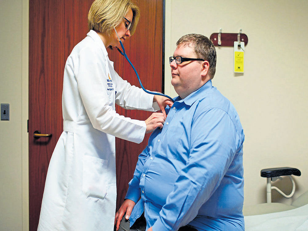 CUTTING&#8200;THE&#8200;FLAB: Keith Oleszkowicz gets examined before his gastric bypass operation in Ann Arbor, Michigan. nyt