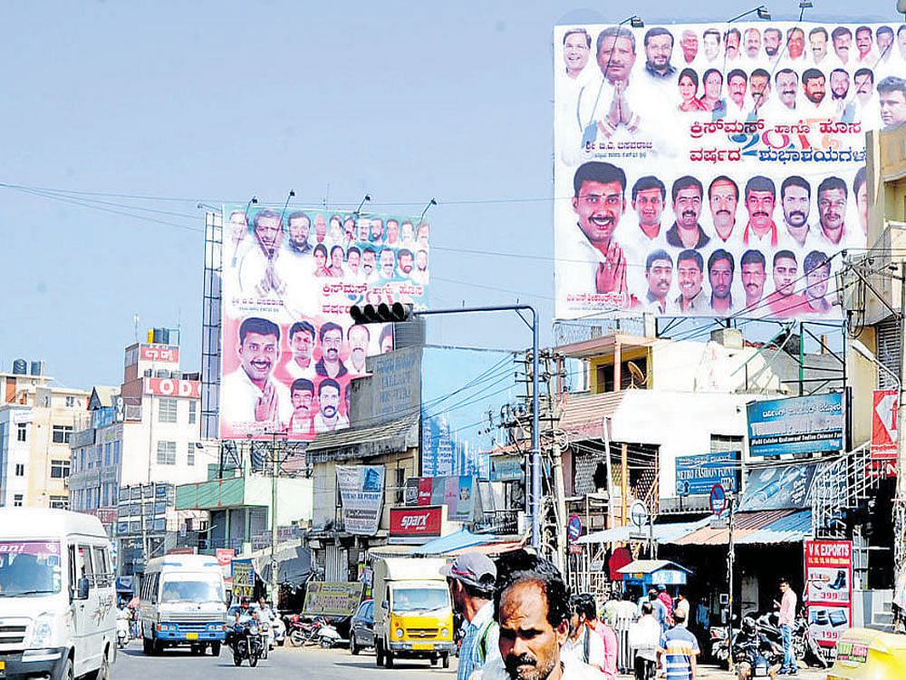 Hoardings put up by political parties in KR Puram. dh photo