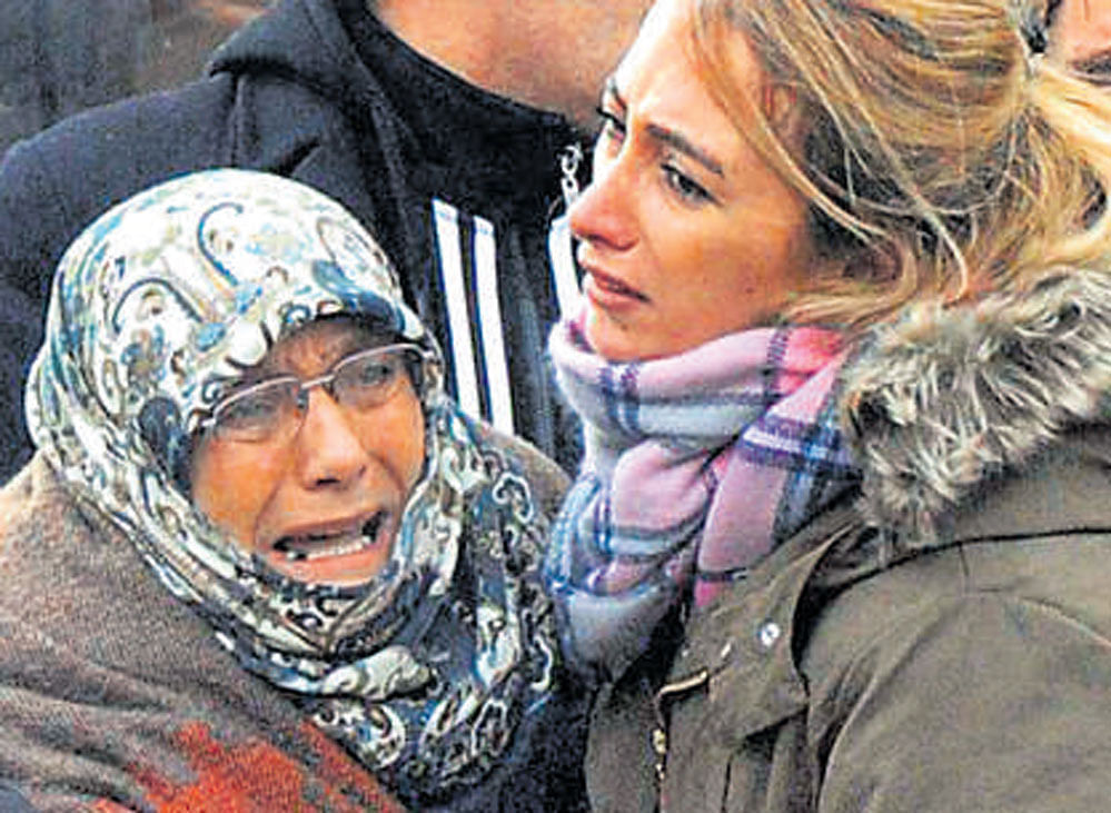Family members of victims mourn outside a morgue in Istanbul on Sunday. AP/PTI
