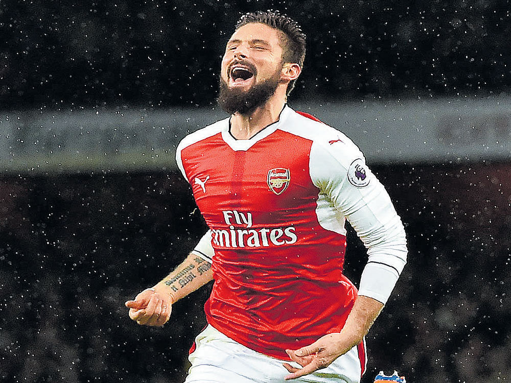 BREATHTAKING STRIKE: Arsenal's Oliver Giroud celebrates after scoring a 'scorpion kick' volley against Crystal Palace in London on Sunday. AFP