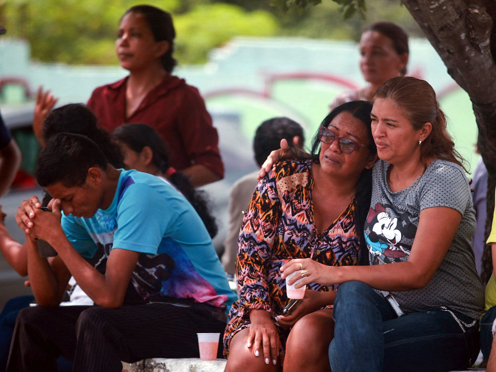 Relatives of prisoners await news in front of the Medical Legal Institute (IML) after the end of a bloody prison riot in the Amazon jungle city of Manaus, Brazil January 2, 2017. REUTERS